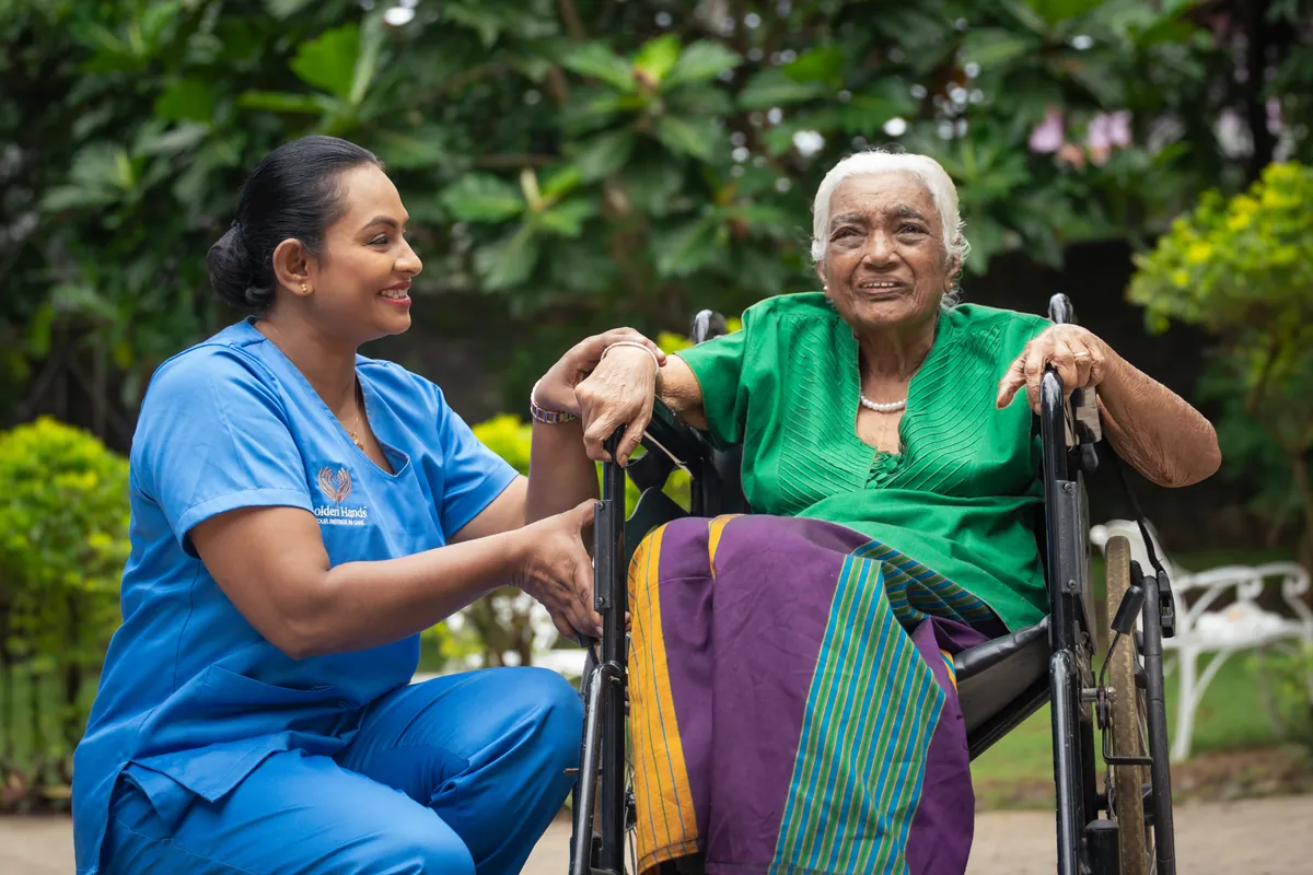 A caregiver helping a resident with a video call